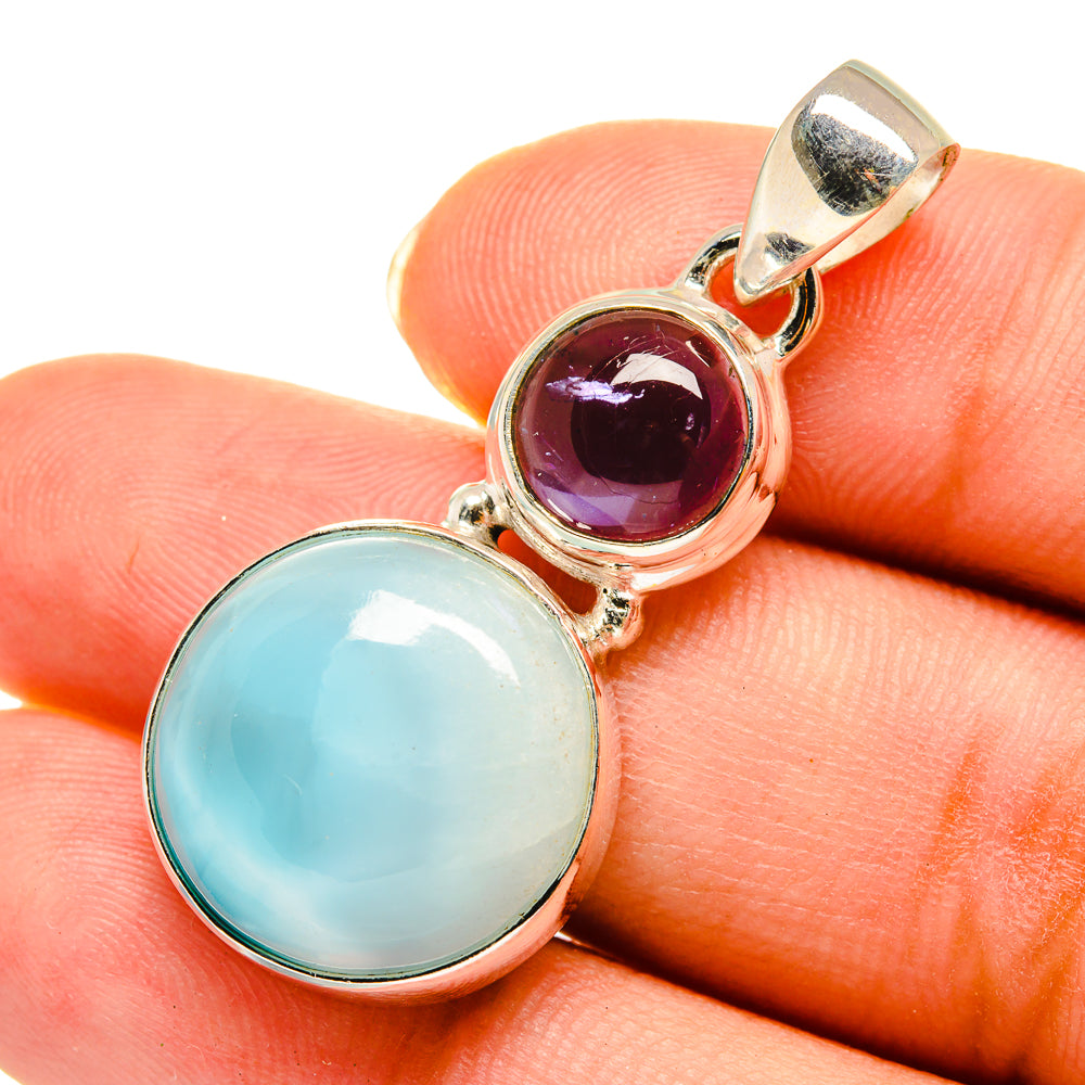 Sterling silver pendant with light blue and deep purple round gemstones