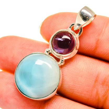 Sterling silver pendant with light blue and deep purple round gemstones