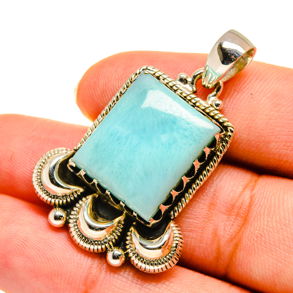 Sterling silver larimar pendant with rectangular light-blue stone and ornate frame