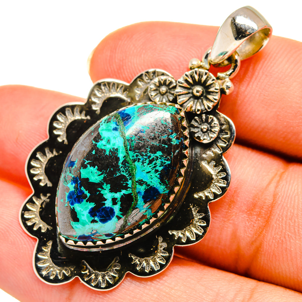 Shattuckite pendant in 925 sterling silver, oval blue-green stone with filigree bezel.