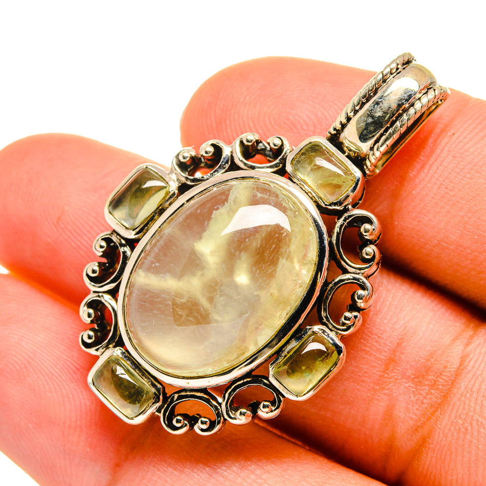 Oval prehnite pendant in gold-tone 925 sterling silver with ornate halo bezel