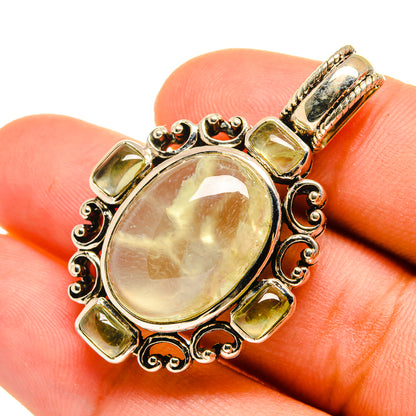 Oval prehnite pendant in gold-tone 925 sterling silver with ornate halo bezel