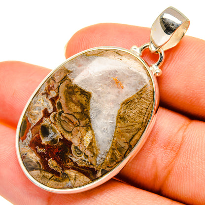 Oval mushroom rhyolite pendant with silver bezel and bail, multicolor stone face