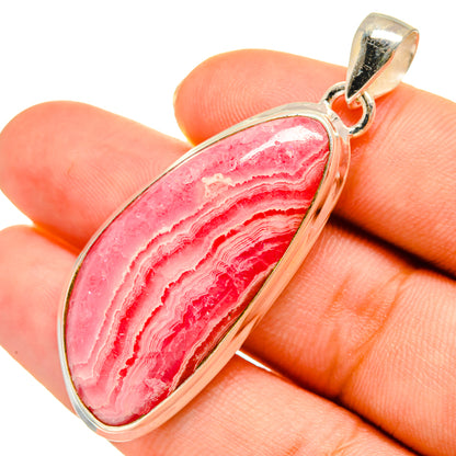 Sterling silver rhodochrosite pendant with oval pink-striped stone and bail