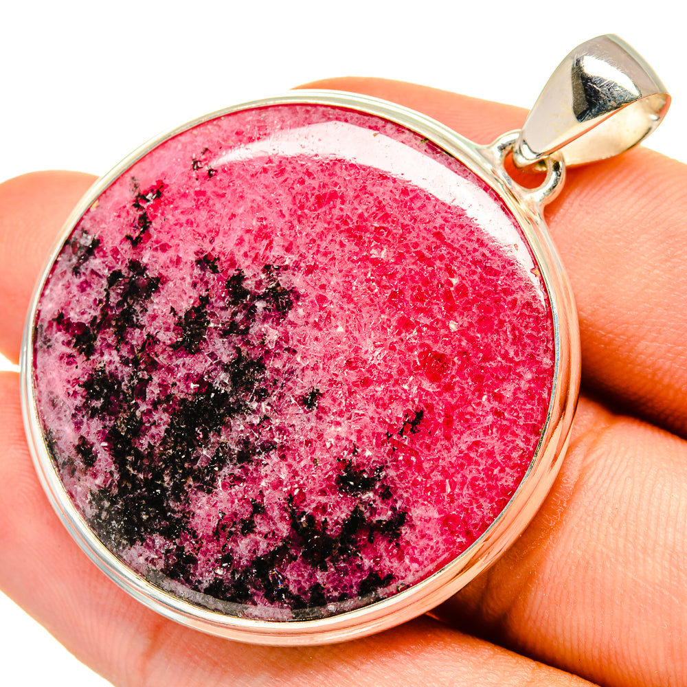 Rhodonite pendant in 925 sterling silver with round red stone and black speckles