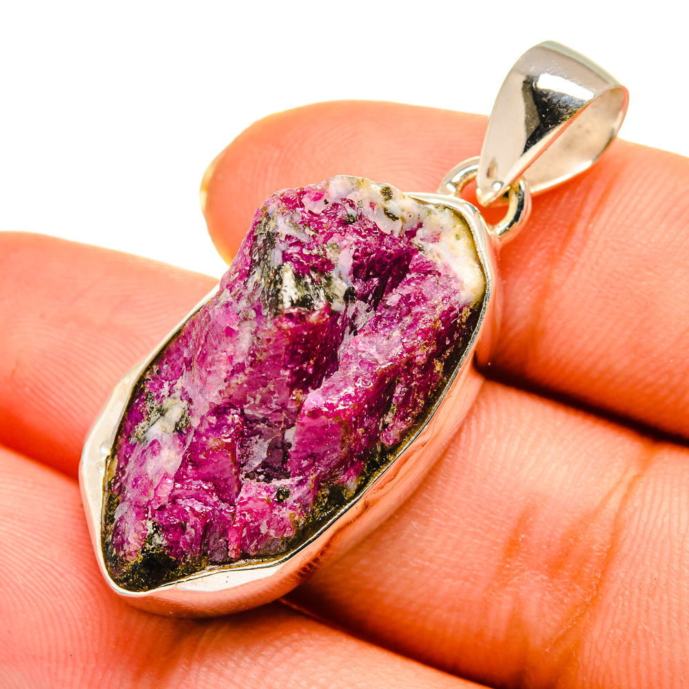 Rough fuchsia fuchsite pendant close-up with green speckles, sterling silver setting