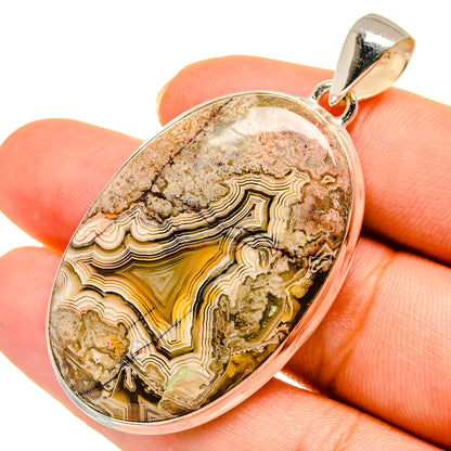 Sterling silver lace agate pendant, oval cabochon with layered tan and amber bands