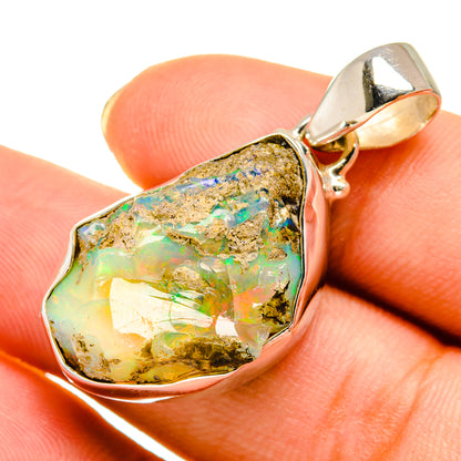 Sterling silver rough opal pendant with faceted green, blue, and gold stone