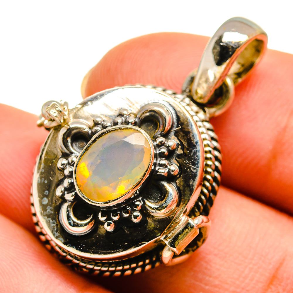 Sterling silver opal poison pendant with oval faceted Ethiopian opal in filigree setting