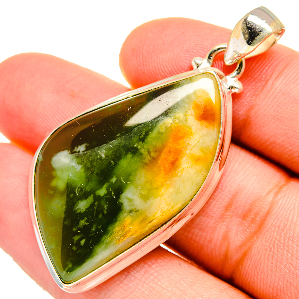 Green, yellow, and dark opal teardrop pendant with silver-tone bail