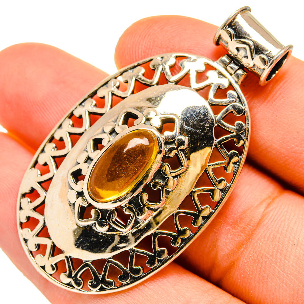 Oval filigree citrine pendant in 925 sterling silver with bail and textured setting