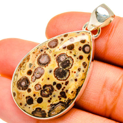 Poppy jasper teardrop pendant with silver bail, marbled orange and dark circular patterns