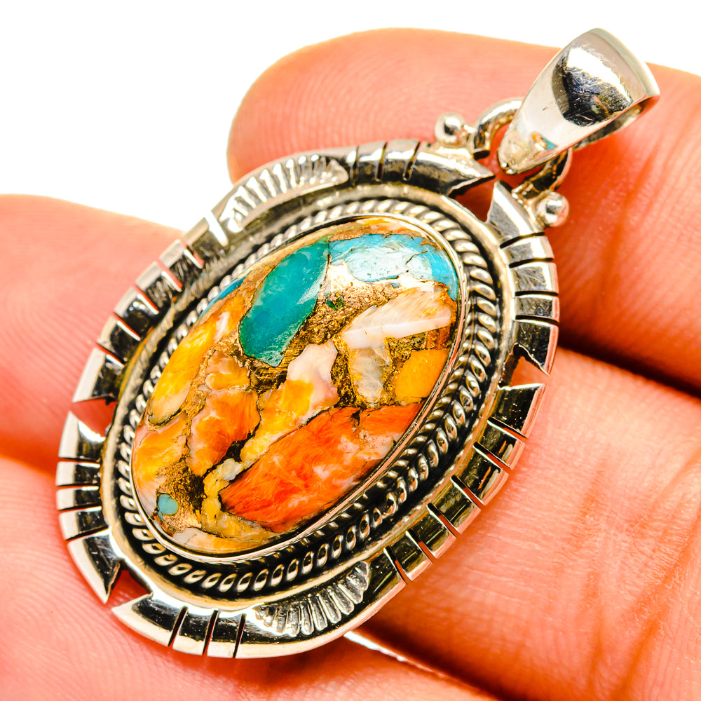 Oval spiny oyster pendant with turquoise inlay and orange/yellow stone, sterling silver frame