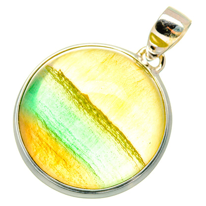 Round fluorite pendant with yellow-green gemstone, green streak, and sterling silver bail