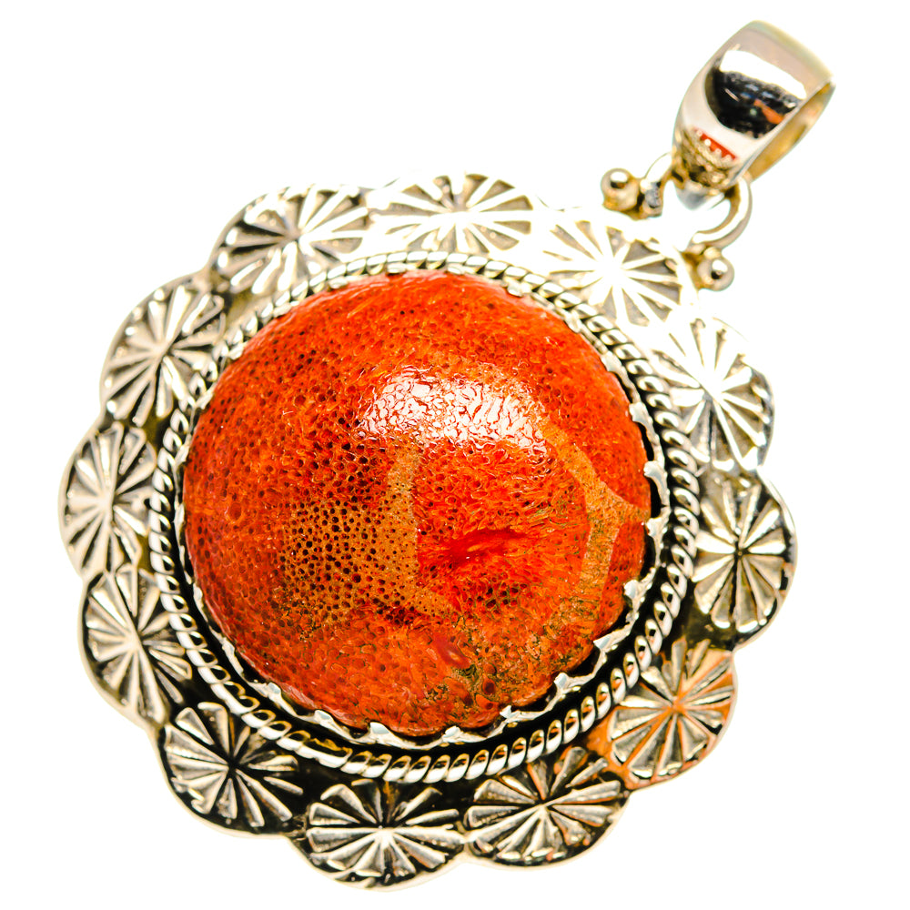 Sterling silver pendant with round orange sponge coral cabochon and ornate scalloped frame