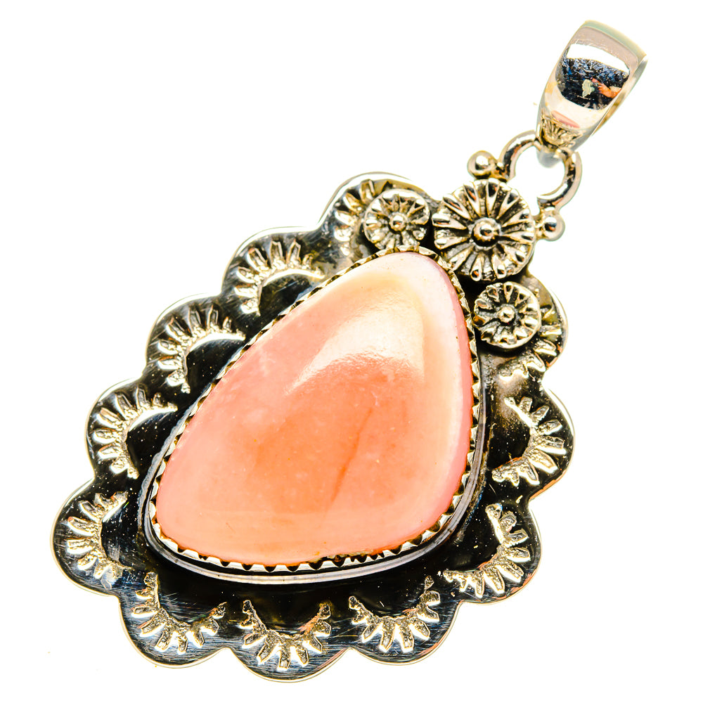 Pink opal teardrop pendant with ornate silver-tone frame and bail