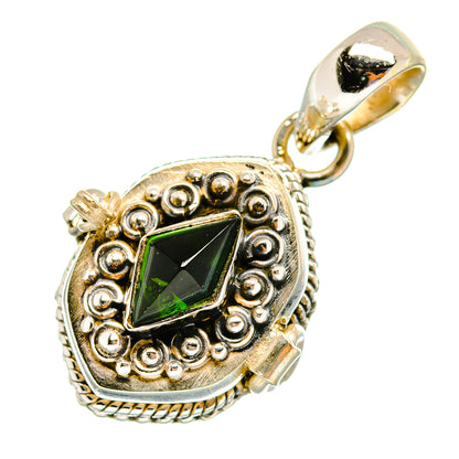 Ornate green gemstone pendant with gold-tone bail, faceted stone in round frame