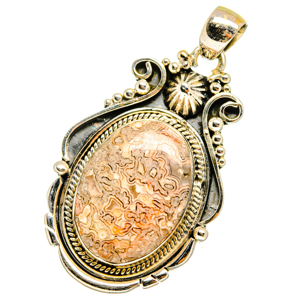 Sterling silver oval lace agate pendant with ornate scrolls and gold-toned bail