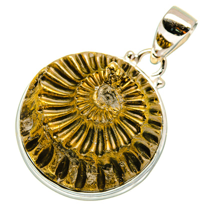 Pyrite fossil pendant in gold disc with ridged center, framed in silver with loop bail