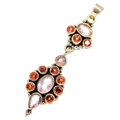 Sterling silver pendant with pink rose quartz center, red garnet halo and teardrops