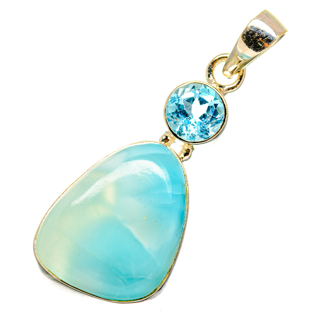 Sterling silver pendant with round blue topaz and pear-shaped larimar cabochon
