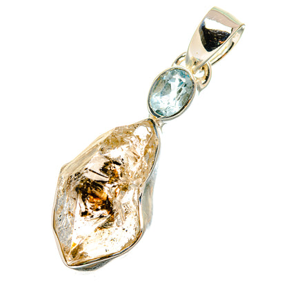 Sterling silver pendant with raw clear diamond and oval light-blue topaz, side view