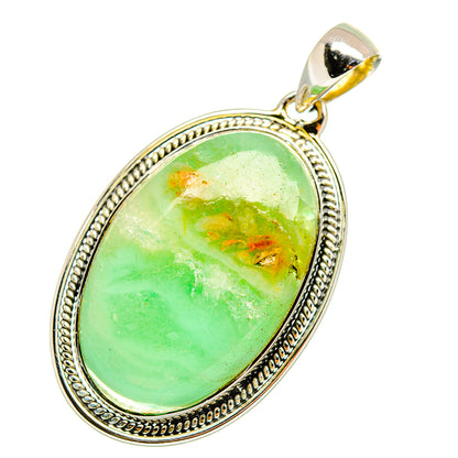 Ocean jasper pendant with oval green cabochon, orange specks, sterling silver frame and bail