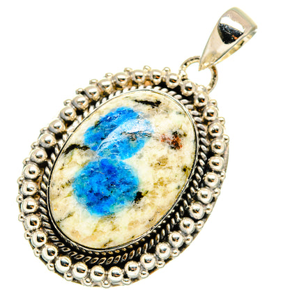 Sterling silver azurite pendant with oval blue cabochon and hanging bail, ornate edge