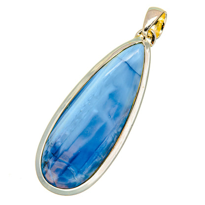 Sterling silver opal pendant with teardrop blue stone, gold-tone top bail