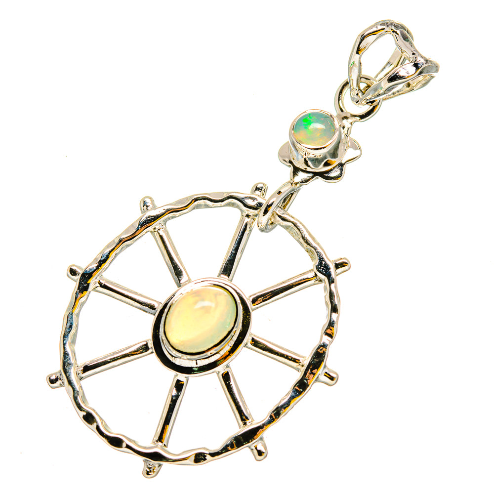 Sterling silver opal pendant with wheel spokes, round pale opal center, top bail
