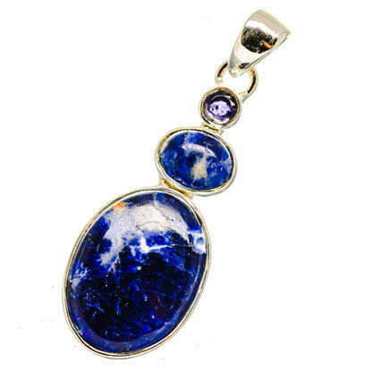 Oval sodalite pendant with two small purple stones in silver-tone bezel setting