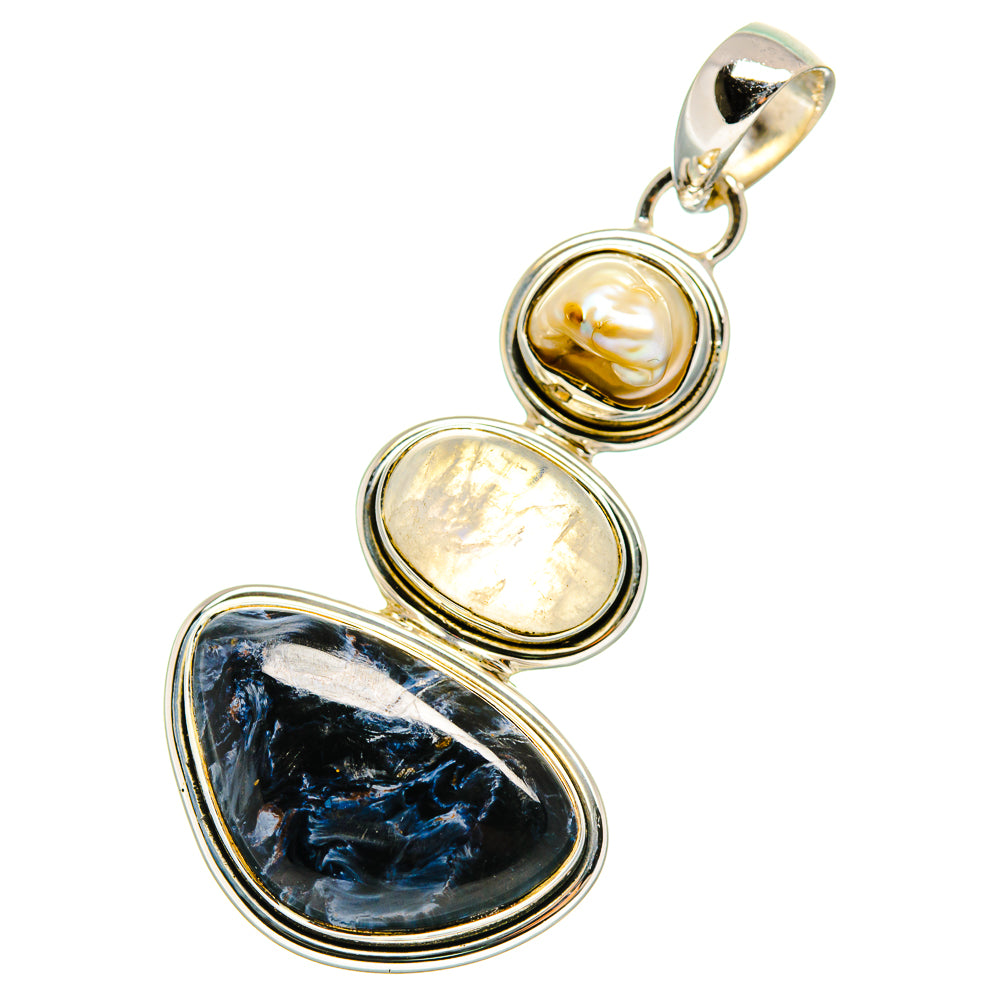 Sterling silver pendant with mother-of-pearl, pale iridescent stone, and dark blue oval gemstone
