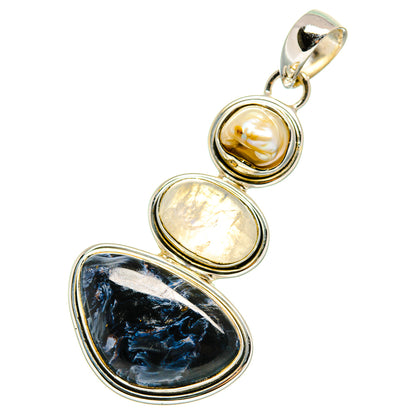Sterling silver pendant with mother-of-pearl, pale iridescent stone, and dark blue oval gemstone