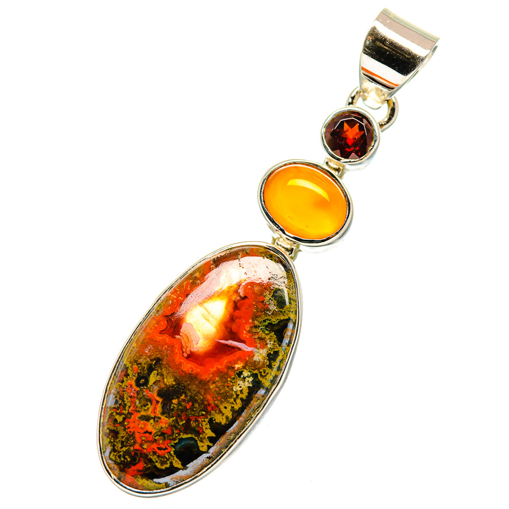 Oval silver pendant with orange and green speckled stone, accented by carnelian and garnet
