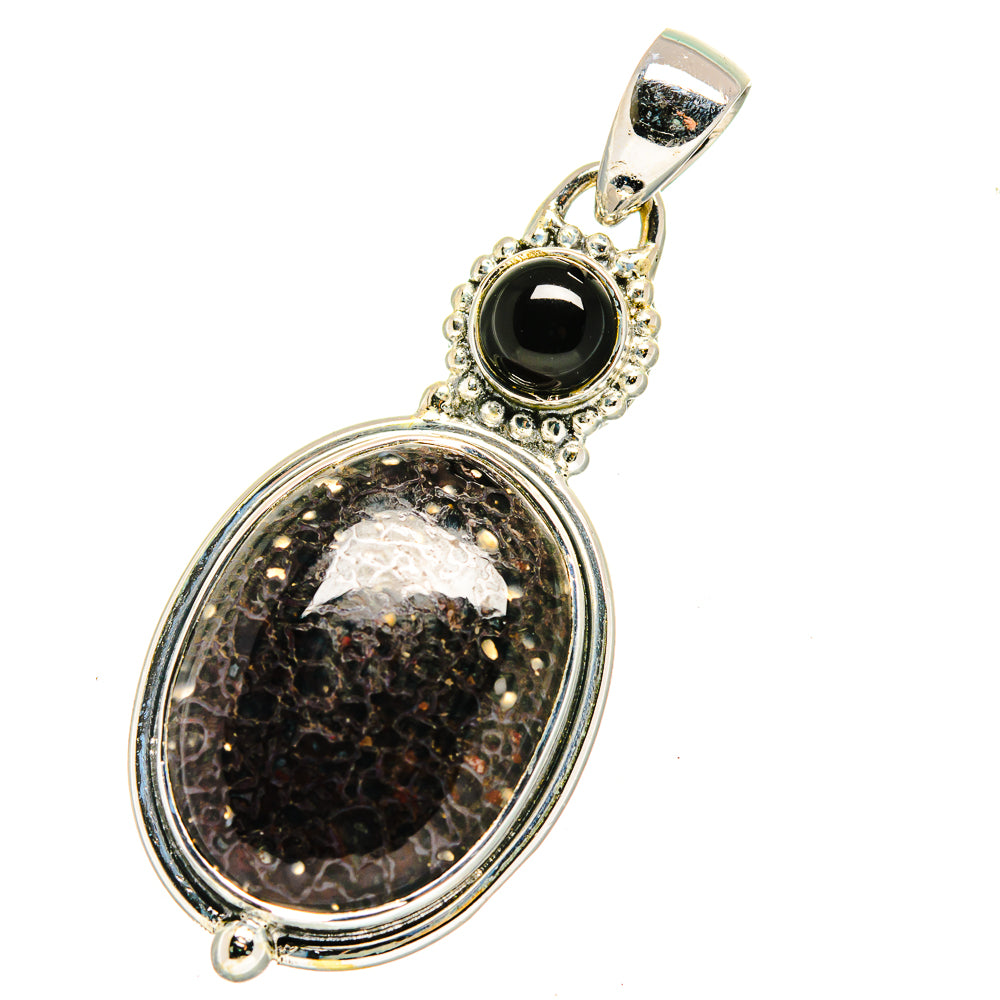 Sterling silver oval pendant with black onyx top and fossilized stone frame