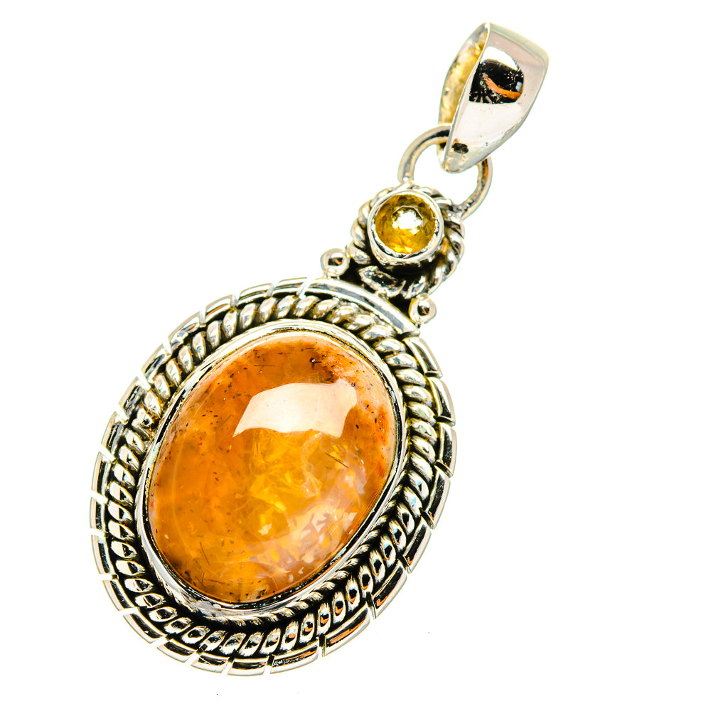 Oval citrine pendant with round yellow stone accent in ornate sterling silver frame