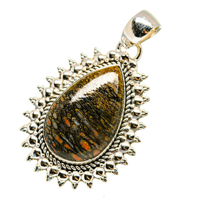 Sterling silver teardrop pendant with fossil-like stone center and scalloped bezel, bail top