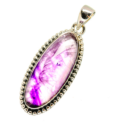 Amethyst pendant in oval sterling silver bezel with beaded border, bail at top
