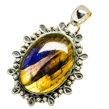 Labradorite pendant in oval sterling silver bezel with ornate teardrop halo, top loop
