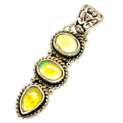 Sterling silver opal pendant featuring three oval opals with rope-edge bezel