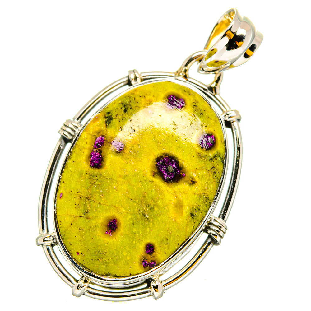 Oval yellow and purple-speckled atlantisite stone pendant with gold-toned bail