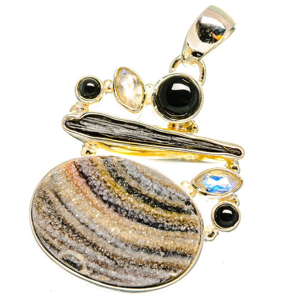 Sterling silver pendant with oval druzy stone, black onyx, and moonstone accents