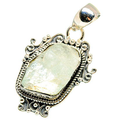 Sterling silver rough oval pale blue gemstone pendant with ornate filigree and bail