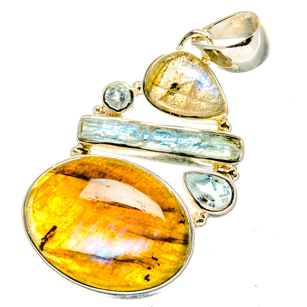 Silver pendant with oval labradorite and blue topaz cabochons on layered bezel