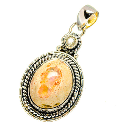 Sterling silver oval pendant with orange fire opal cabochon and ornate bezel