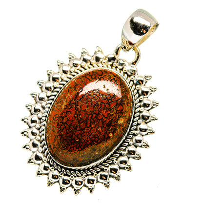 Oval red-brown mottled cabochon pendant with silver beaded halo and bail
