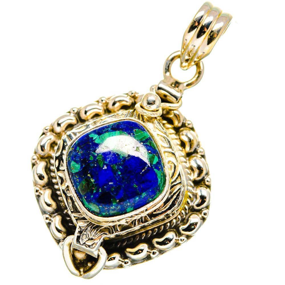 Sterling silver pendant with blue oval cabochon gemstone, decorative filigree border and bail