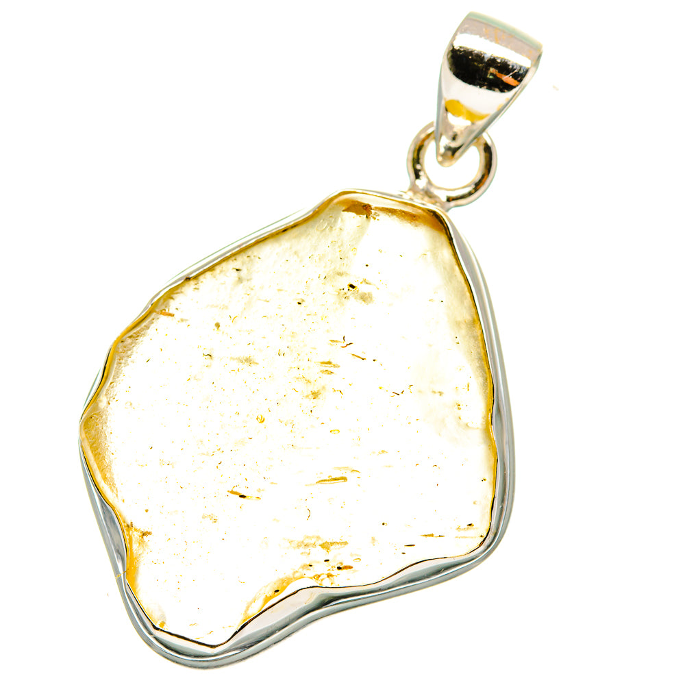 Yellow glass pendant with sterling silver bezel and loop bail, irregular cushion shape