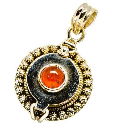 Gold-tone poison-style pendant with dark enamel and round orange carnelian cabochon