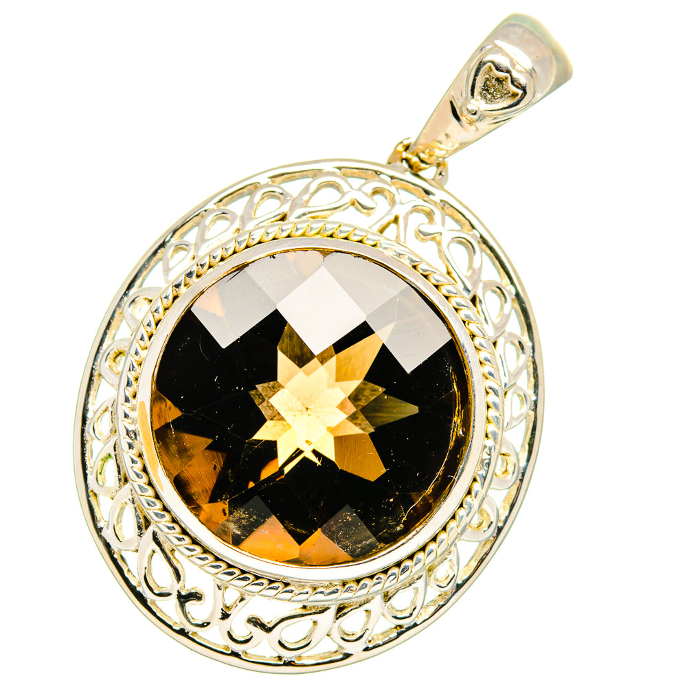 Sterling silver pendant with dark faceted smoky quartz and ornate round filigree bezel